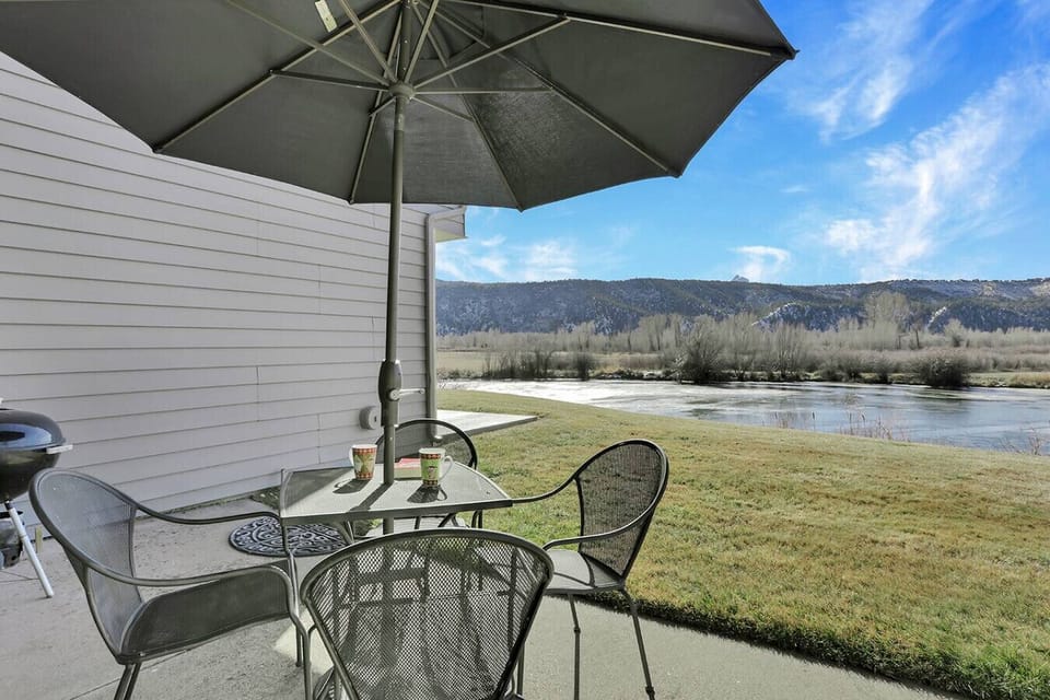Patio seating overlooking pond