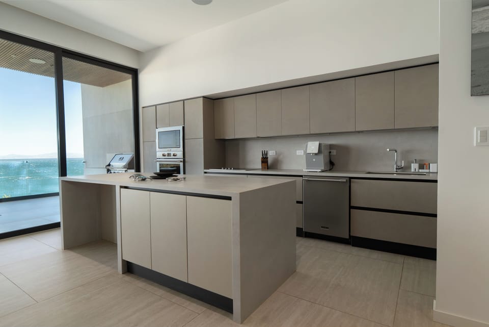 Luxury Condo, Ocean View | Private kitchen | Full-size fridge, oven, stovetop, dishwasher