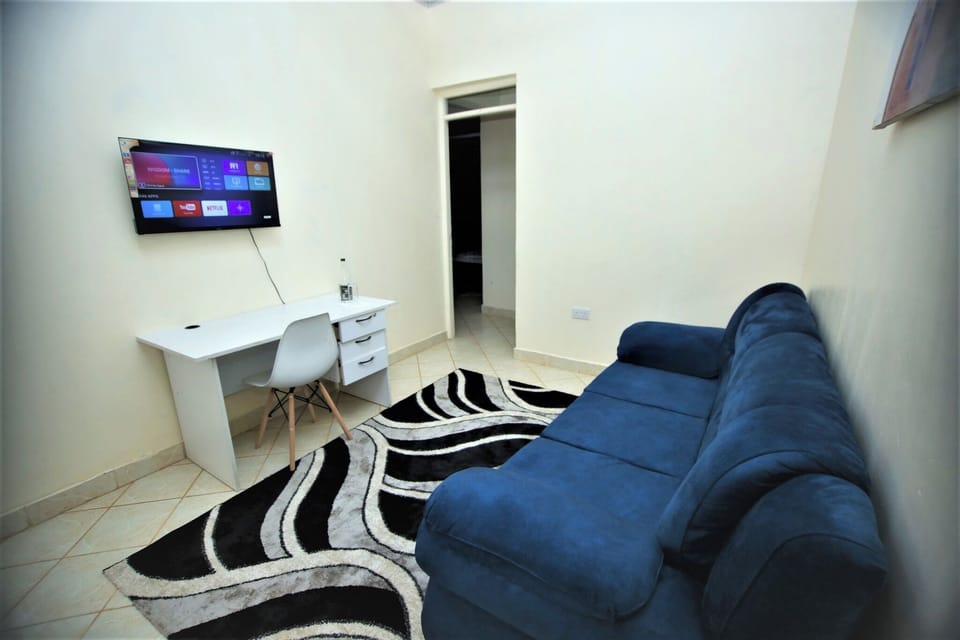 Business Apartment | Living area | 24-inch Smart TV with digital channels