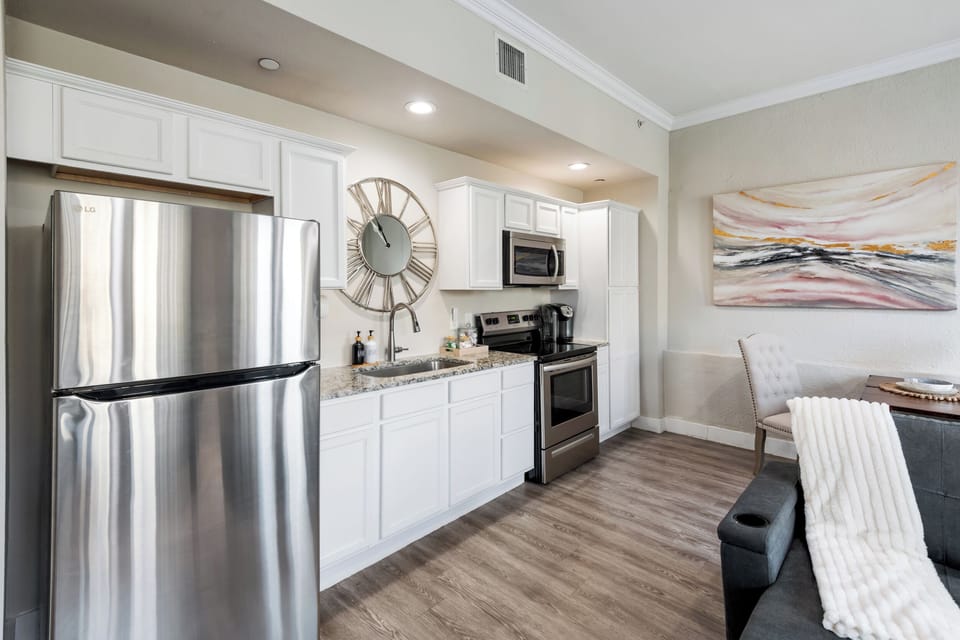 Kitchen features stainless steel appliances, granite counter tops and LED can lighting.