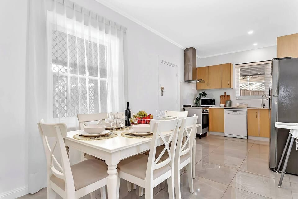 Gather around the six-seater dining table to share meals and stories after a long day exploring the nearby River Torrens trails.