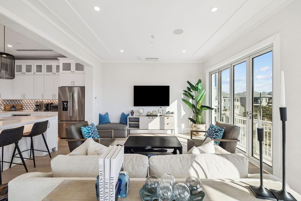 Sink into plush seating and soak up natural light streaming through expansive windows in your modern living space.