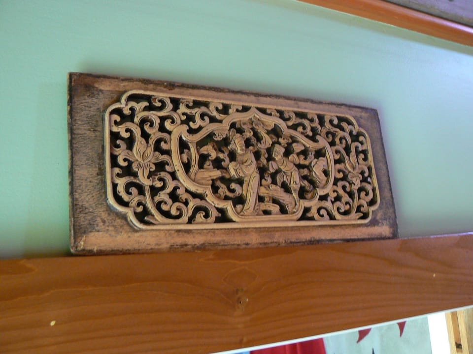 Antiques and small touches make the apartment feel cozy and warm