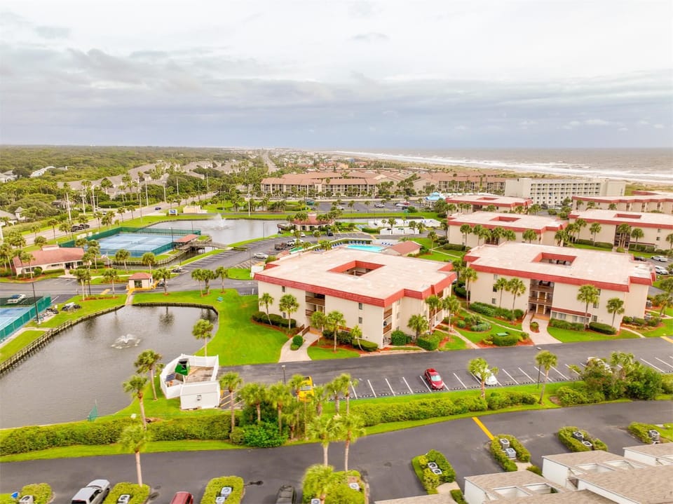 - Aerial view of St Augustine Ocean and Racquet Resort shows pools, tennis courts and beach  
- Beautifully landscaped community provides great amenities for guests  
- Ideal location steps from the shoreline and attractions  
