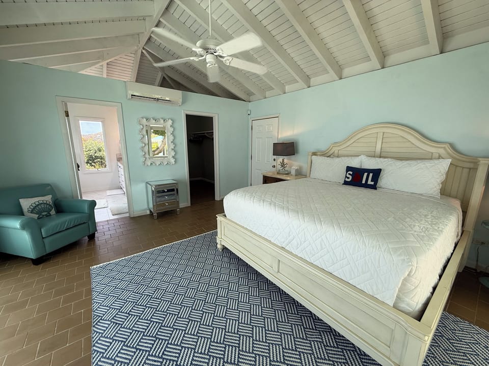 Relax and recharge in this peaceful island-inspired bedroom.