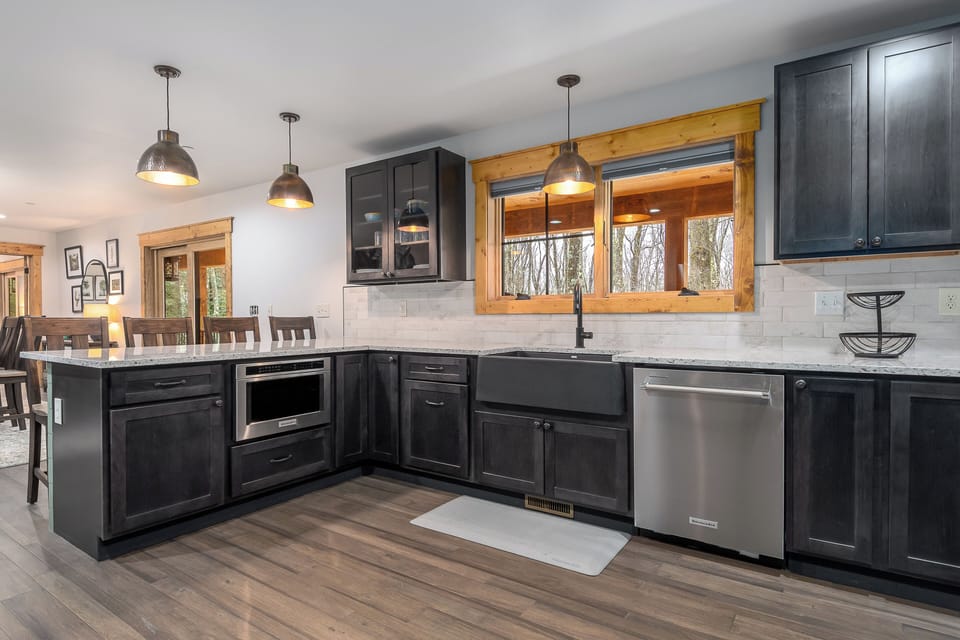 Under the counter Microwave and 4 bar stools