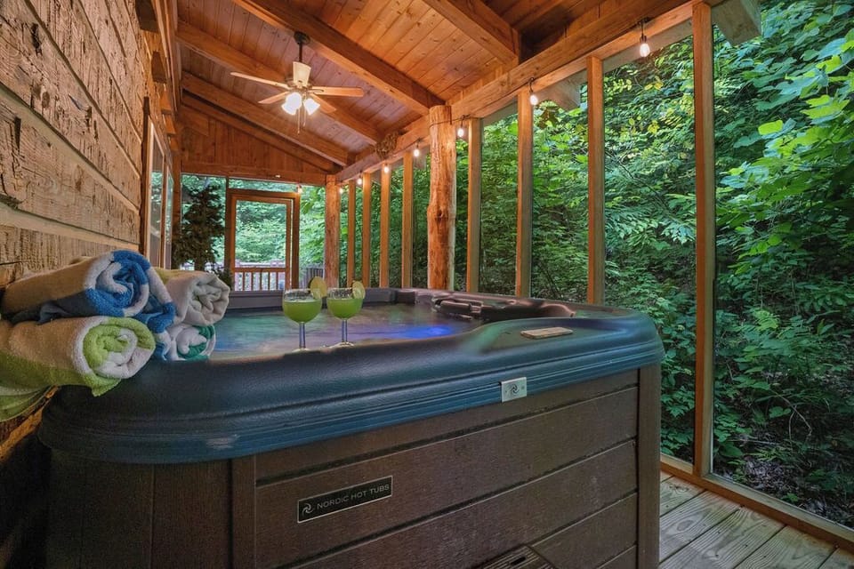 Screened-in hot tub retreat with peaceful forest views