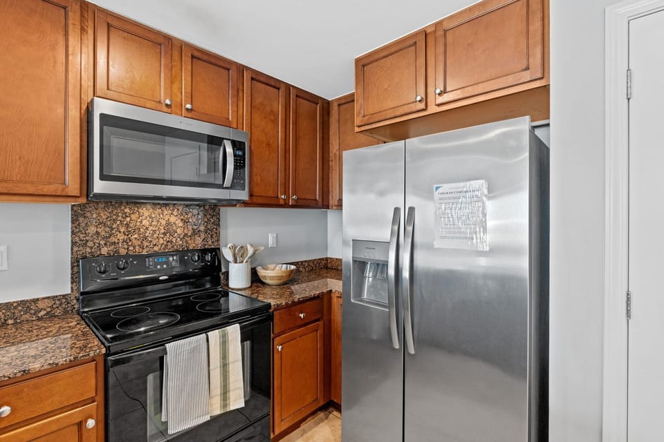 The kitchen is a bright, functional, and inviting space designed for both convenience and coastal charm.