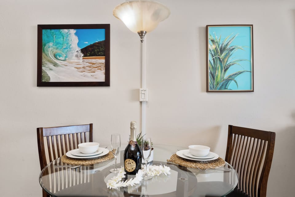Share wine and laughter in a cozy, art-filled nook.