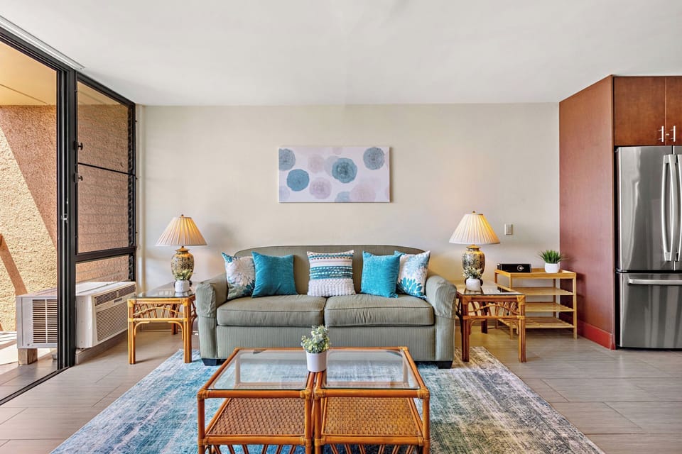 Window AC and ceiling fans keep the living room cool and comfortable.