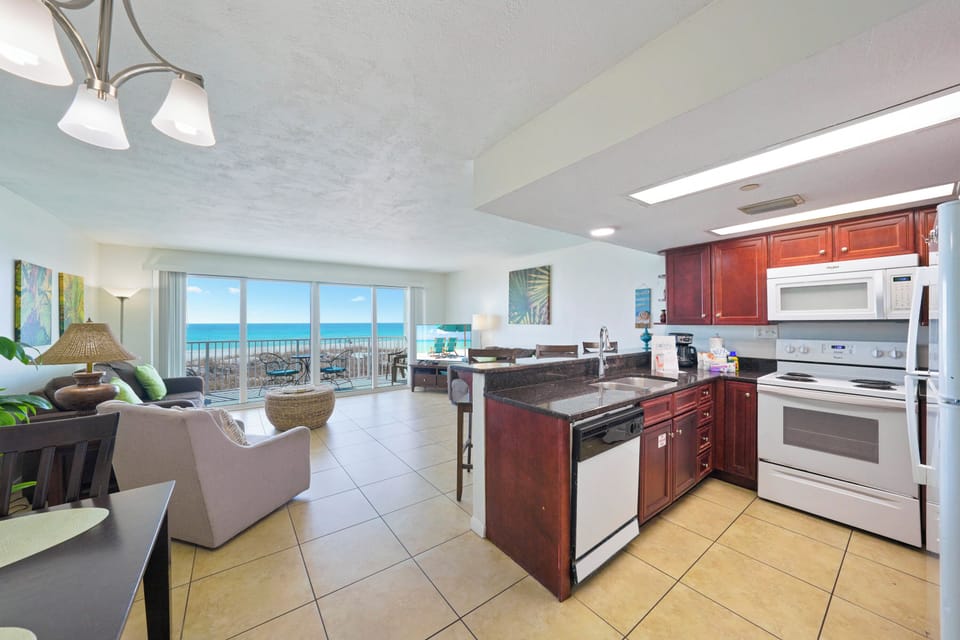 Cabana Club of Destin family beach rental with spacious kitchen, all white appliances, and fully stocked with the most popular cookware needs.