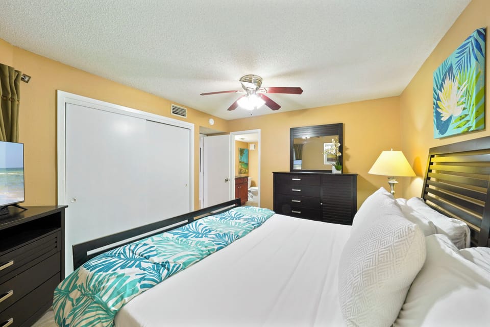 This spacious king bedroom at Cabana Club 106 offers coastal charm and modern comfort just steps from the white sand beaches of the Emerald Coast.