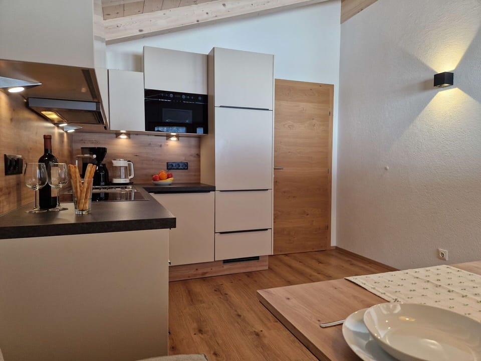 Interior Design, Furniture, Flooring, Wood, Light Fixture, Countertop, Kitchen, Ceiling, Kitchen Appliance, Home Appliance