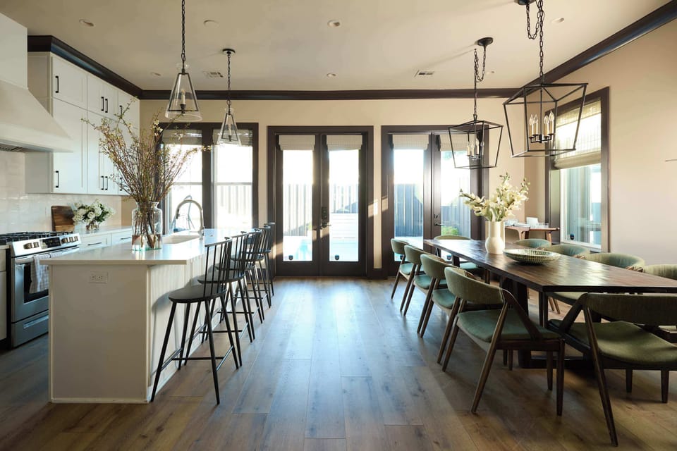 Kitchen | Chef's Kitchen with Island and Dining Area | Home A — First Floor