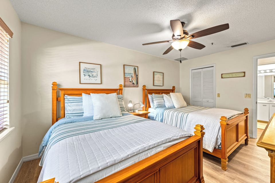 Perfect for families, this inviting bedroom includes two full-size beds.