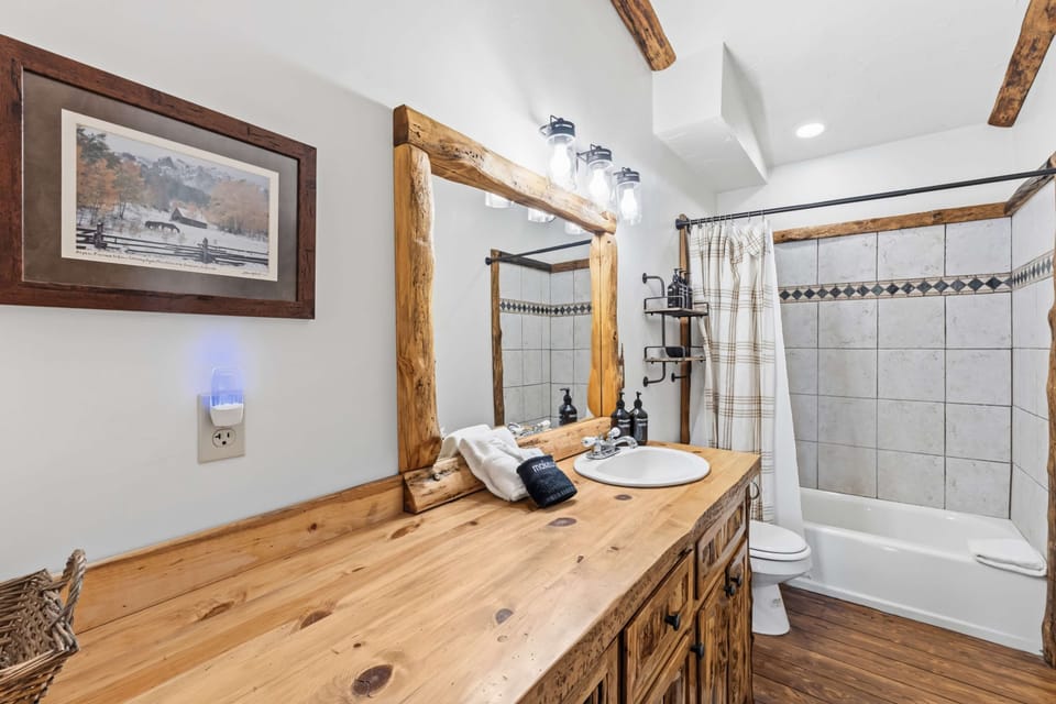 
Main Cabin: Shared Bathroom with single vanity and shower/tub combo
