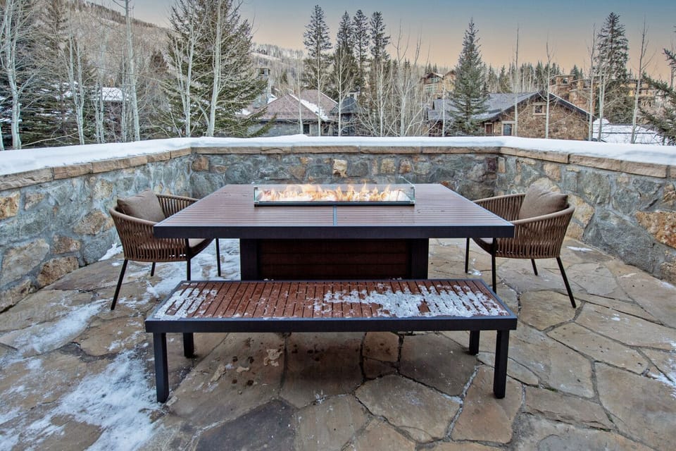 The expansive front deck features a gas grill, fireplace seating area, and stunning views toward Beaver Creek Village and Vail Valley beyond. Grill dinner as the sun sets, gather by the fire under starlight, and take in the mountain panorama