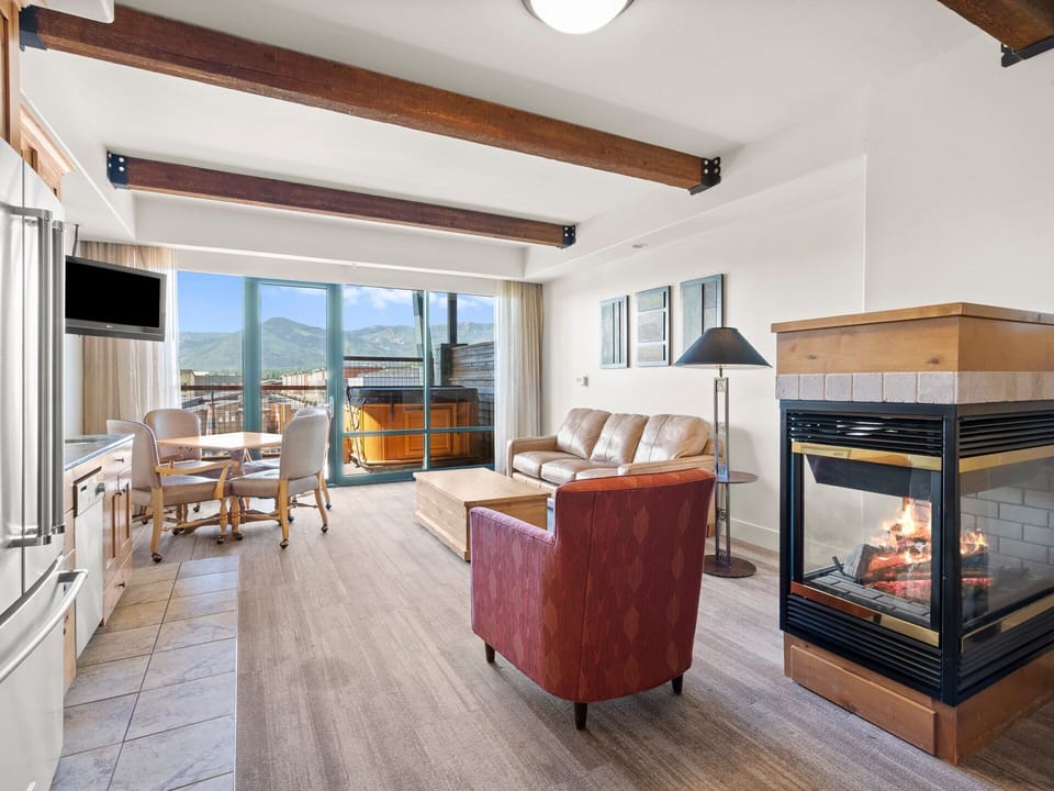 Gase fireplace, living area with queen sofa sleeper, and a dining table!
