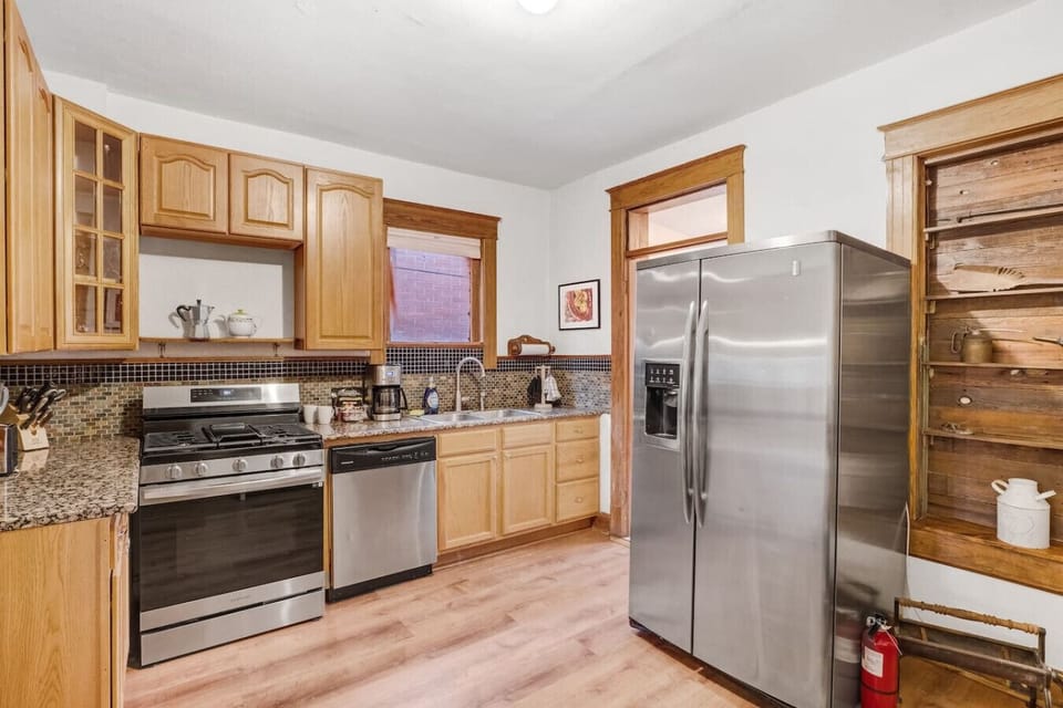 An updated kitchen with stainless steel appliances makes cooking meals in a breeze