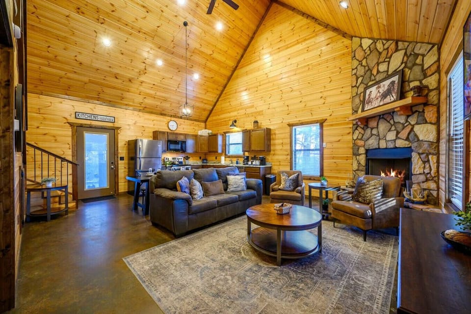 This open-concept cabin has vaulted ceilings, a cozy fireplace, and plenty of space to spread out with the whole crew.