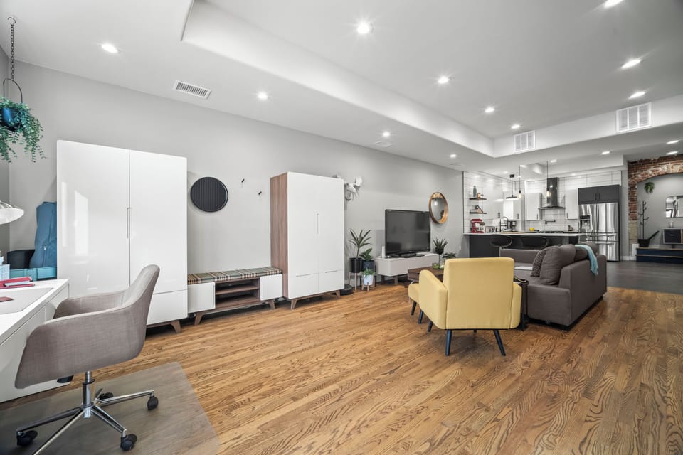 Ample living room storage with practical details throughout the space.