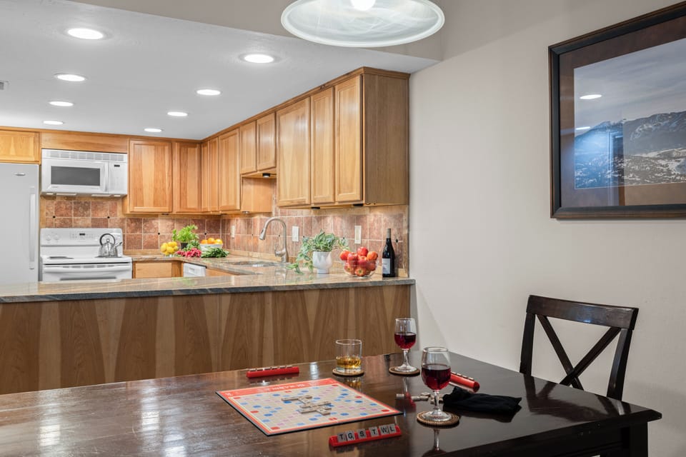 Kitchen view highlighting the breakfast bar—ideal for quick snacks or morning coffee.