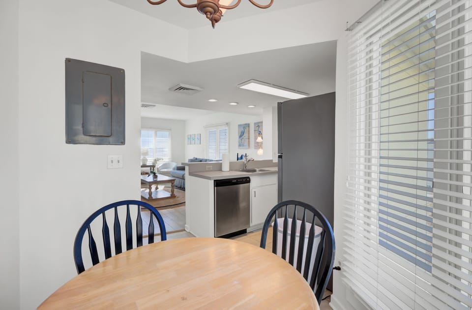 Dining area with a round wooden table.