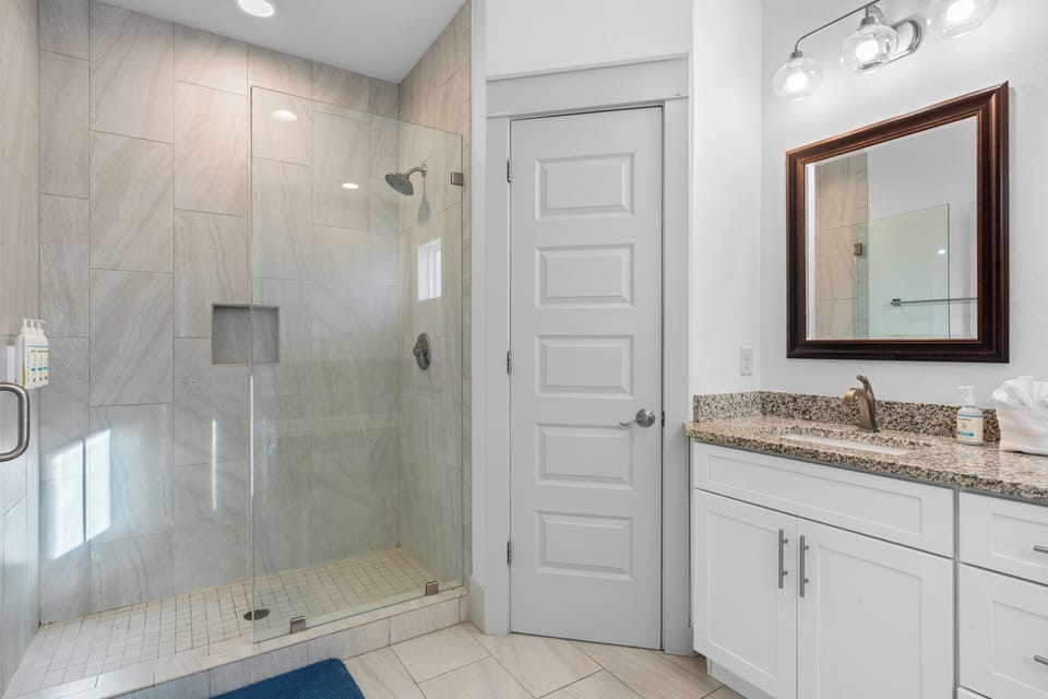 The primary bedroom's ensuite features a soaking tub and a shower.