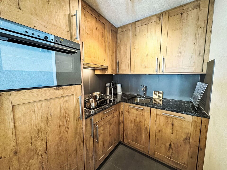 Cabinetry, Wood Stain, Drawer, Hardwood, Countertop, Cupboard, Plywood, Plank, Wood Flooring, Kitchen
