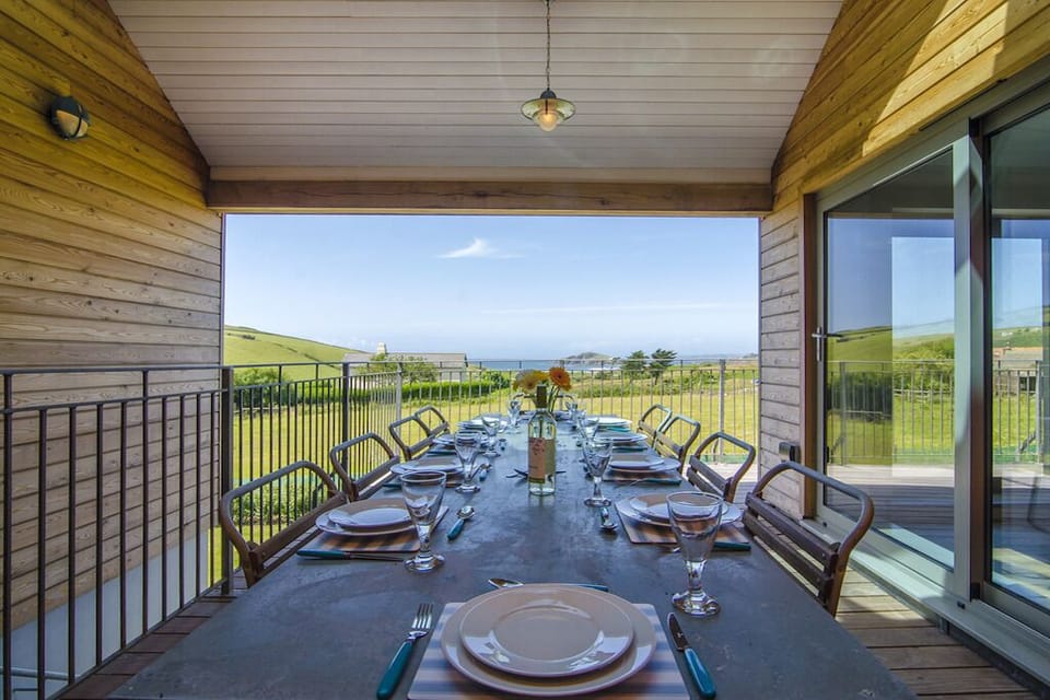 Outdoor covered dining area on the balcony