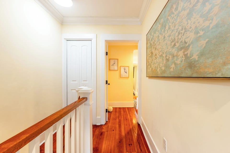 Upstairs hallway leading into the second primary suite