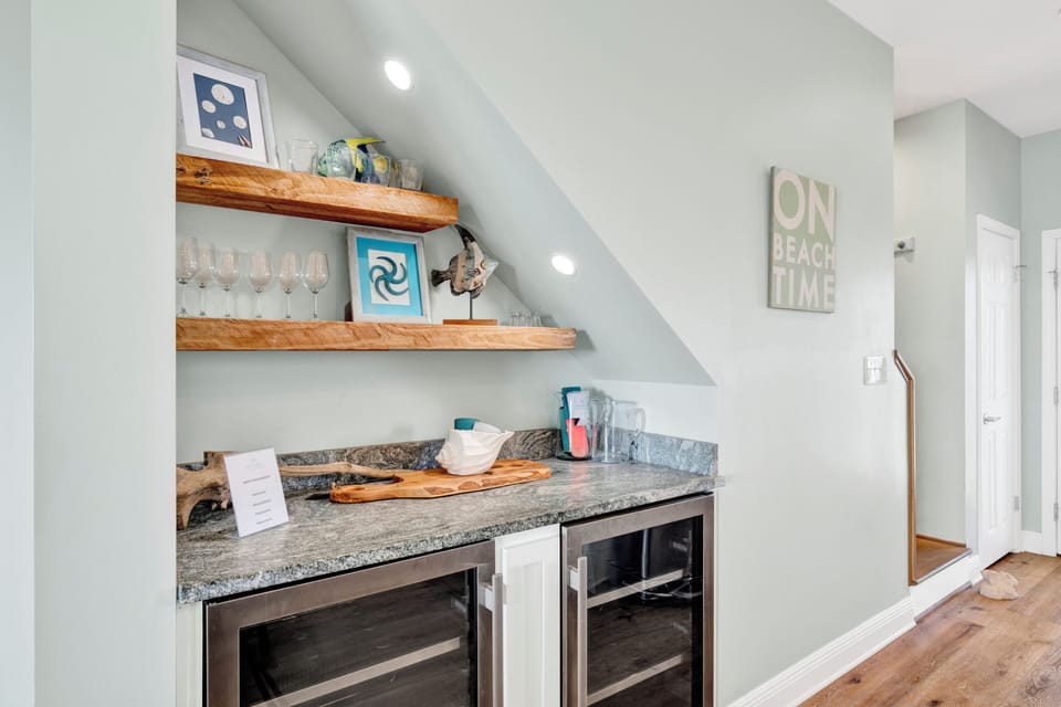 A dry bar with two wine cooler, perfect for entertaining