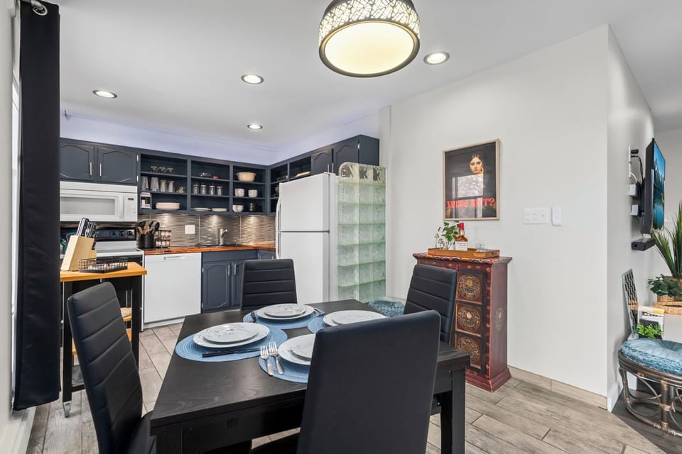 Your elegant dining space flows seamlessly into a fully-equipped kitchen, creating the perfect setting for memorable meals together.