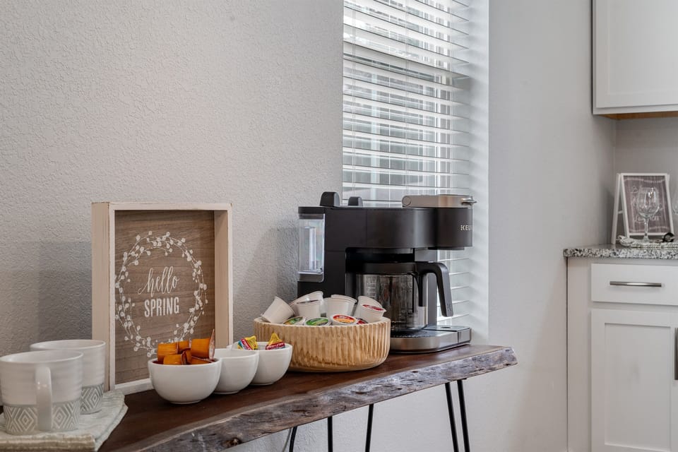 “Fuel your mornings with a dedicated coffee and beverage station—perfect for slow starts or quick refuels before heading out. Thoughtful touches like this make the space feel intentional, not just functional.”