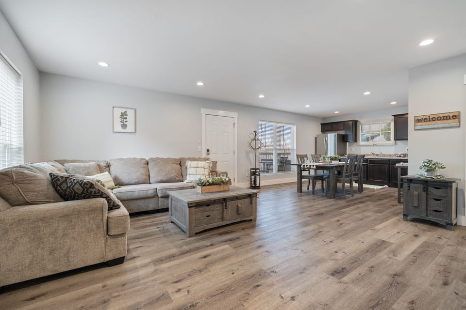Open-concept living, dining, and kitchen area designed for relaxing and reconnecting. Comfortable seating, plenty of natural light, and an easy flow make this the ideal space for movie nights, shared meals, or unwinding after a day at the lake or exploring