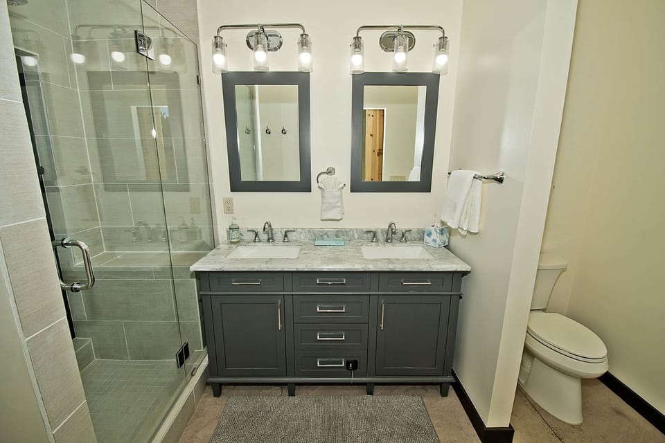 Master Bathroom with Glass Shower Robes Included