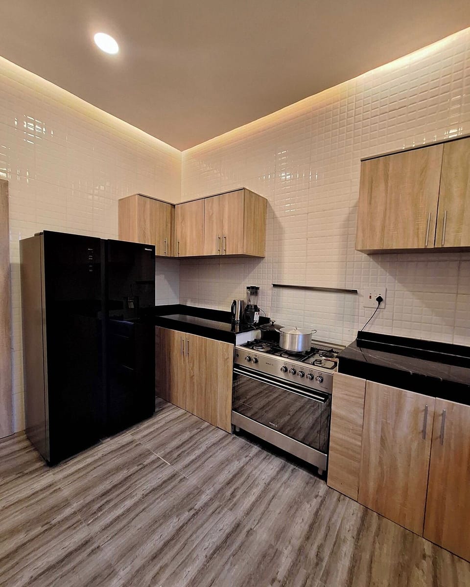 Family Apartment, Balcony, City View | Private kitchen | Fridge, microwave, oven, stovetop