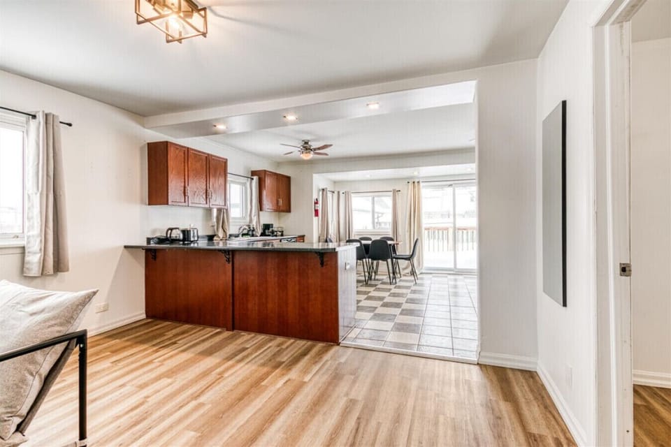Enjoy the perfect blend of modern convenience and classic charm in this open concept layout. The spacious kitchen and bright dining area create an inviting atmosphere that makes it easy to feel right at home during your stay.