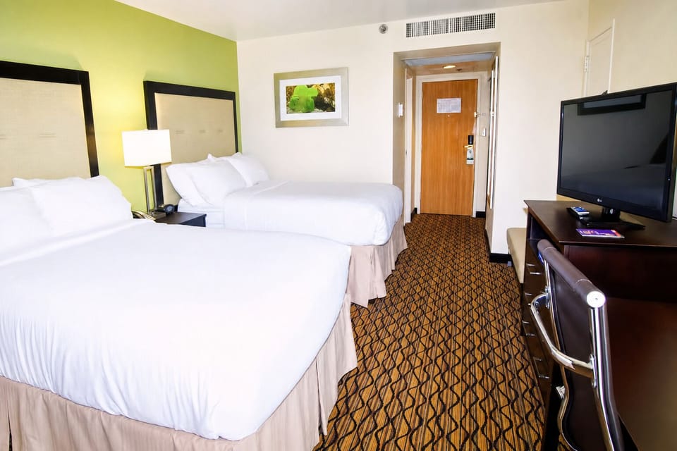Stretch out in a bright room with two cloud-soft beds.