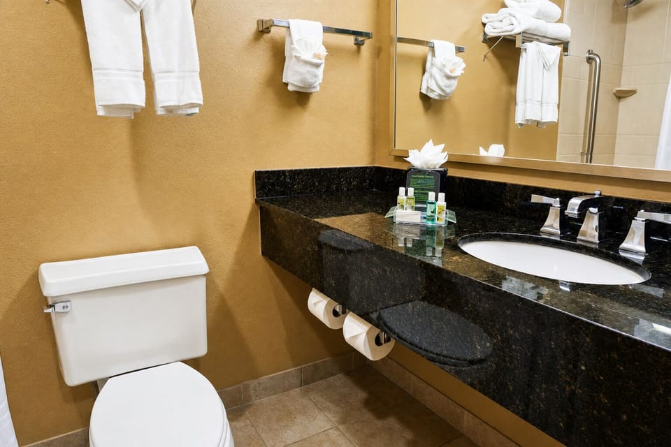 Refresh in a well-stocked bath with plush towels and space.