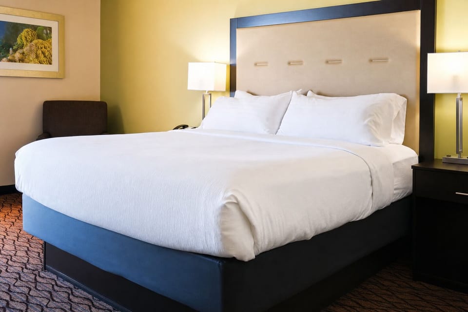 Sink into crisp linens for a deeply restful night’s sleep.