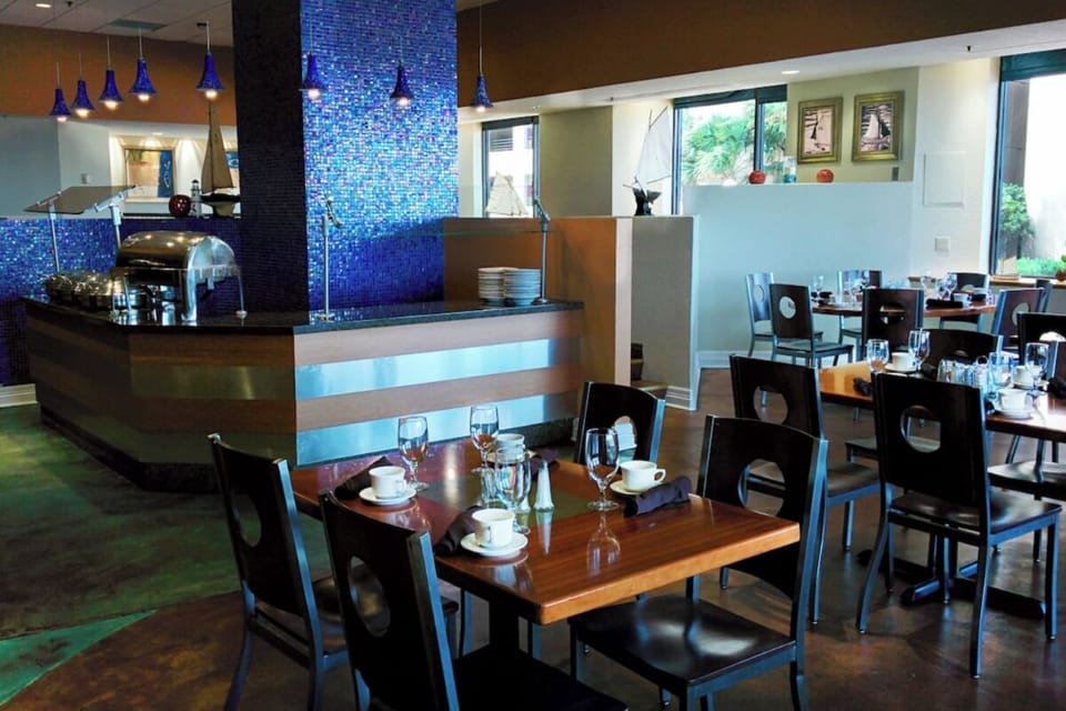 Enjoy a leisurely meal at beautifully set tables and modern décor.