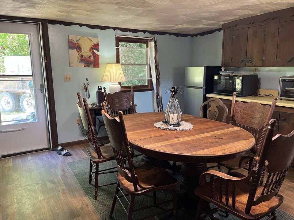 Experience the perfect blend of style and functionality in this dine-in kitchen, seamlessly integrated with the open floor plan of the living area. This thoughtfully designed space comes equipped with a convenient small refrigerator, a convection microwav