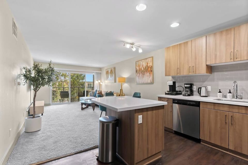 Bright open-concept kitchen flowing into a spacious living area.