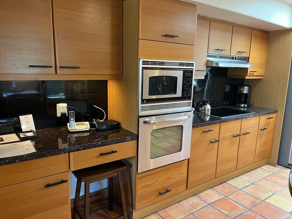 Kitchen has modern appliances and generous counter space.