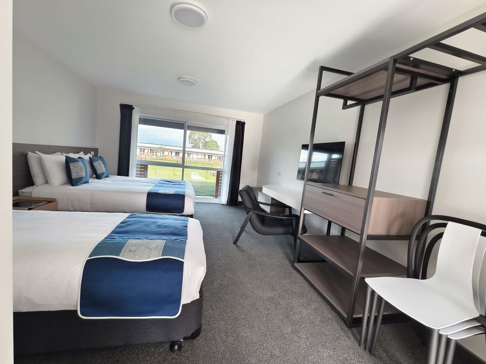 Spacious open-plan triple studio with sleeping, dining and storage areas.
