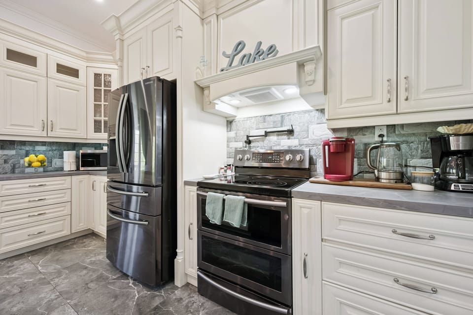 Cook with ease in the well-stocked kitchen featuring modern appliances and plenty of workspace.