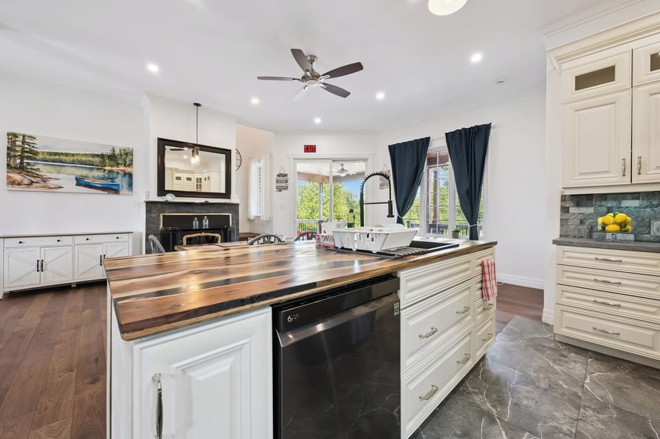 Gather around the large kitchen island while enjoying views of the dining and living areas.