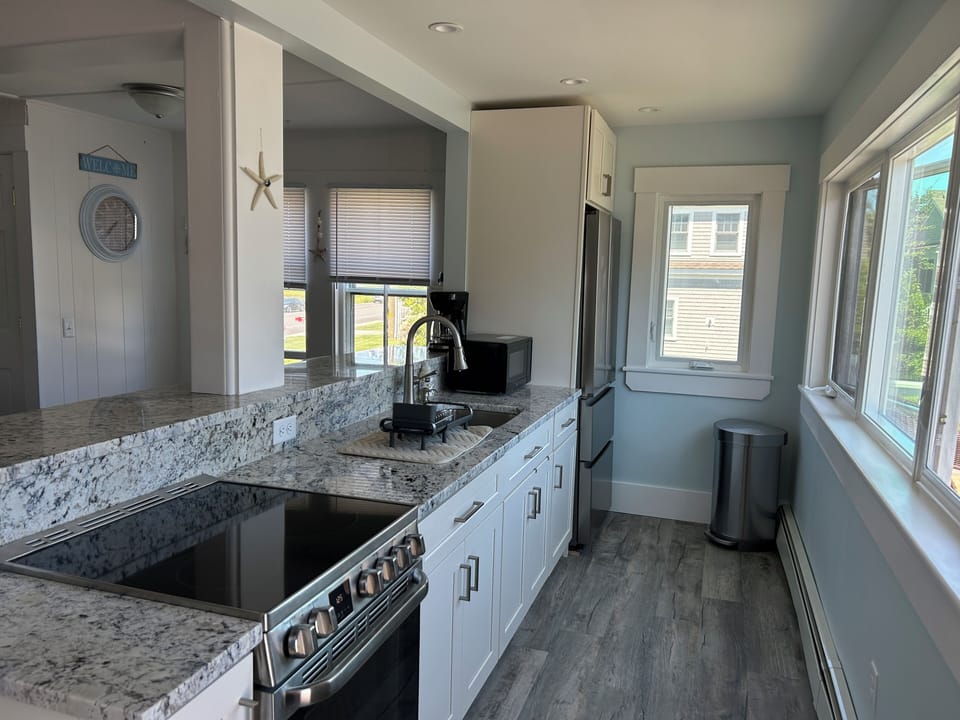 Upstairs (Unit 3 )  - kitchen overlooking the back yard/ocean  