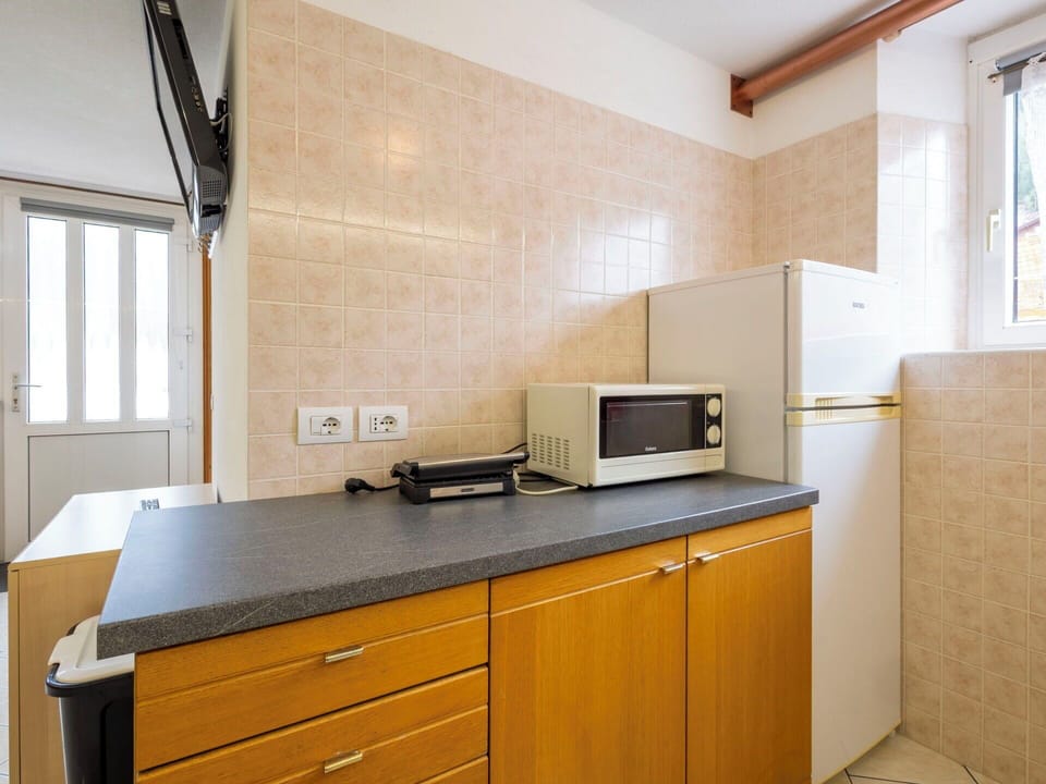 Kitchen, Countertop, Kitchen Appliance, Major Appliance, Cabinetry, Flooring, Kitchen Sink, Interior Design, Sink, Floor